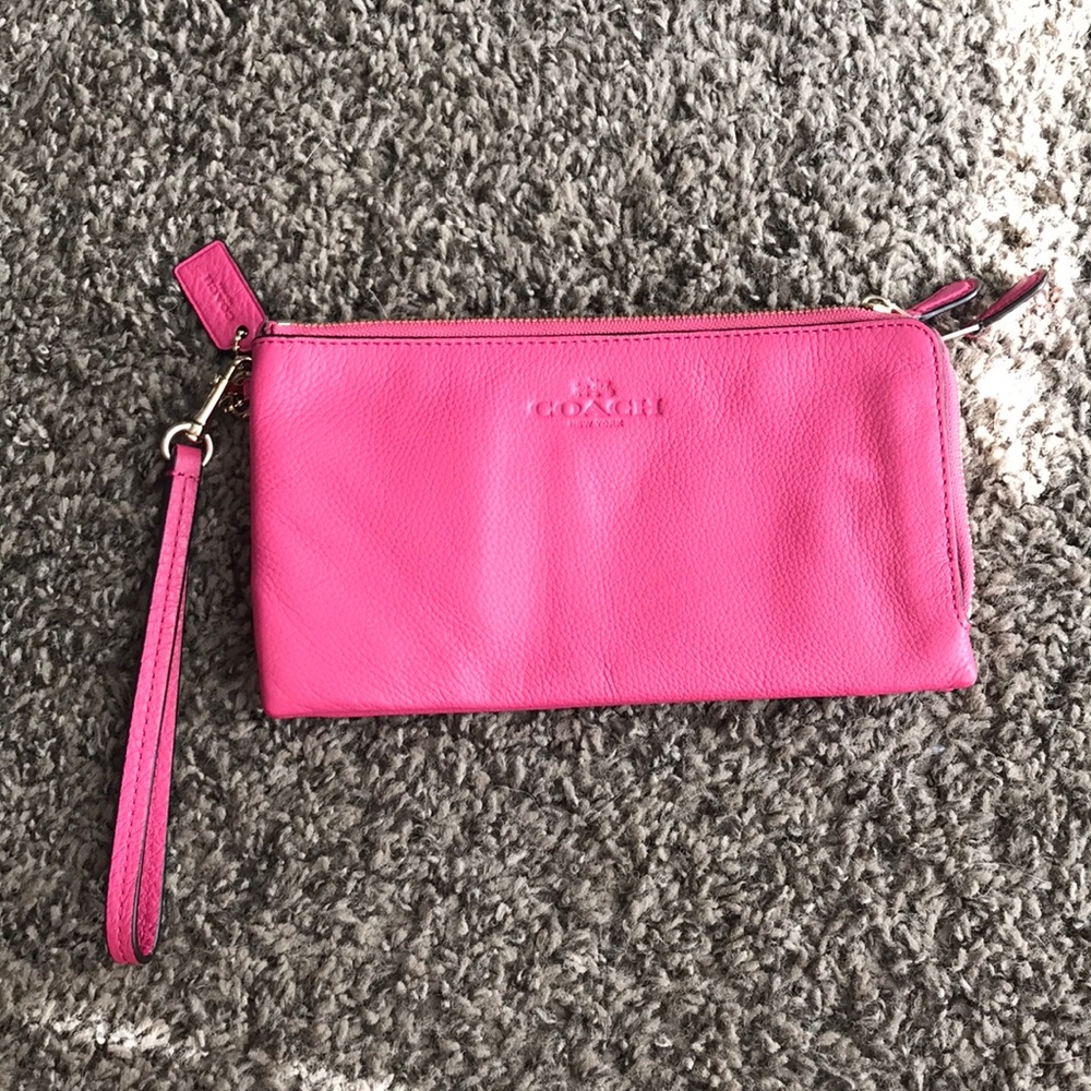 Pink coach leather double zipper wristlet.